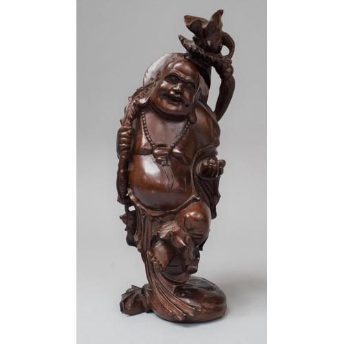 283 - A Chinese Carved Wooden Buddha, 26cm high