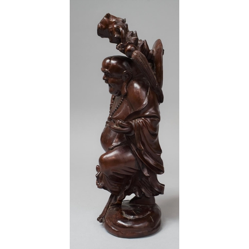 283 - A Chinese Carved Wooden Buddha, 26cm high