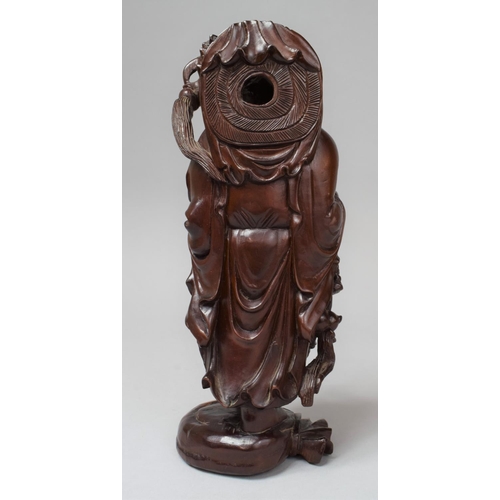 283 - A Chinese Carved Wooden Buddha, 26cm high