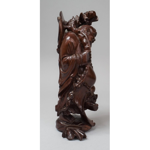 283 - A Chinese Carved Wooden Buddha, 26cm high