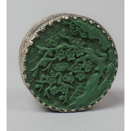 292 - An Oriental White Metal Mounted Circular Box with Green Cinnabar Style Top, 5.5cm Diameter