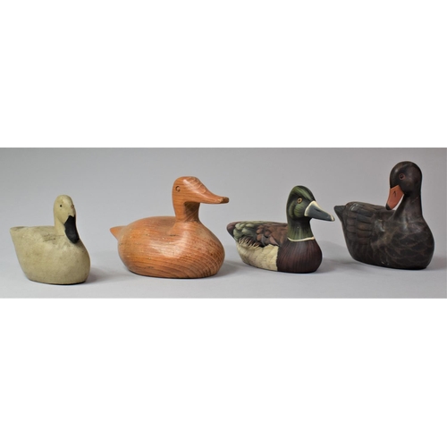 96 - A Collection of Four Wooden Modern Decoy Duck Style Ornaments