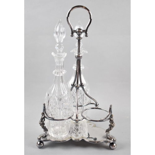 113 - An Edwardian Silver Plated Three Bottle Stand Containing Pair of Cut Glass Decanters, Stand 43cm Hig... 