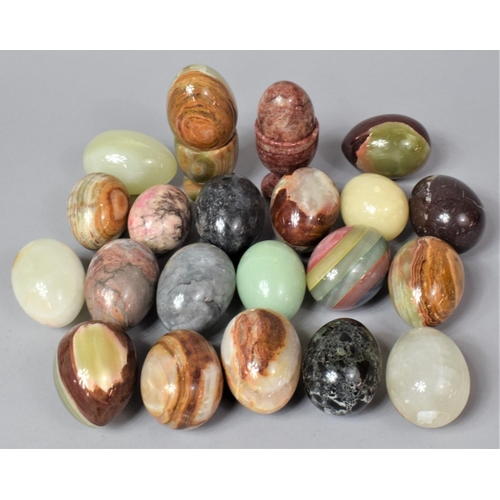 237 - A Collection of Various Onyx Eggs and Two Onyx Egg Cups