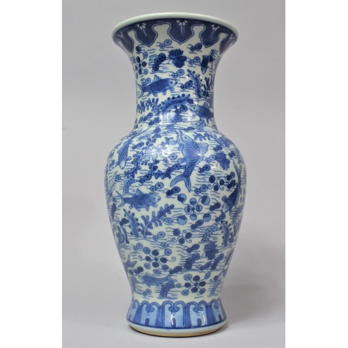 264 - A Modern Chinese Blue and White Vase Decorated with Fish Amongst Reeds, 28cm high