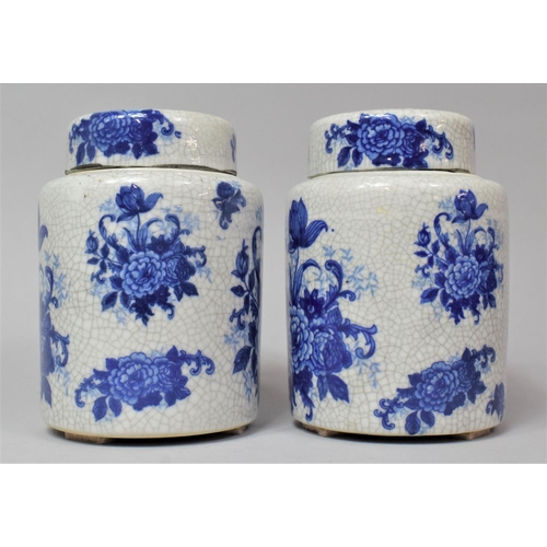 265 - A Pair of Blue and White Grackle Glazed Floral Transfer Decorated Lidded Ginger Jars, 16cm high