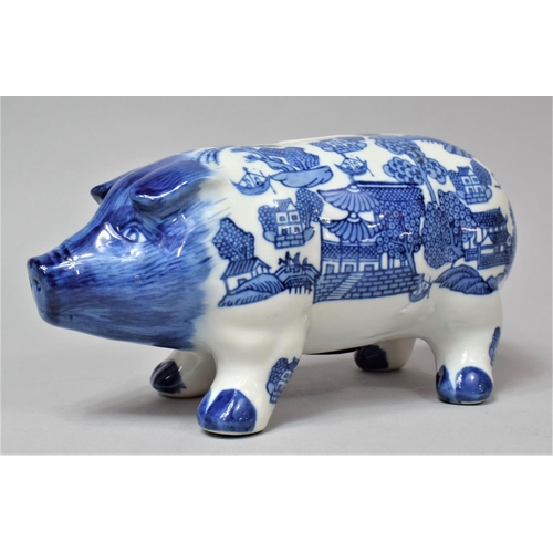 268 - A Blue and White Willow Pattern Piggy Bank, 25cm Long