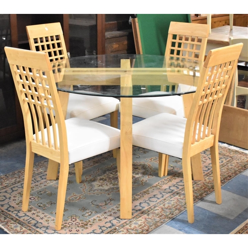 652 - A Modern Circular Glass Topped Table and Four Modern Dining Chairs