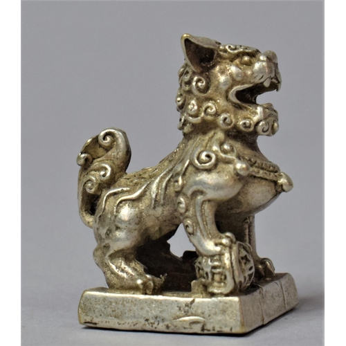 242 - A Small Oriental white Metal Seal in the form of a Temple Dog