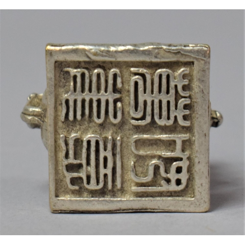 242 - A Small Oriental white Metal Seal in the form of a Temple Dog