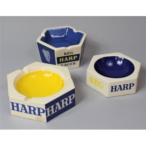 317 - A Collection of Three Harp Lager Advertising Ashtrays