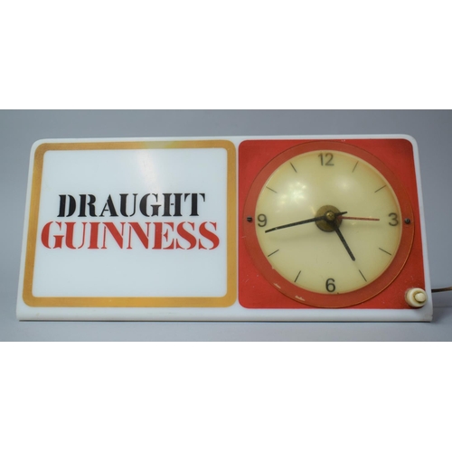 319 - A Vintage Illuminated Shelf Mount Adverting Clock for Draught Guinness