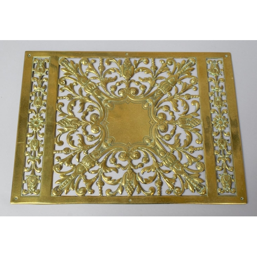 65 - A Pierced Brass Panel Decorated with Flowers, 29x21cm