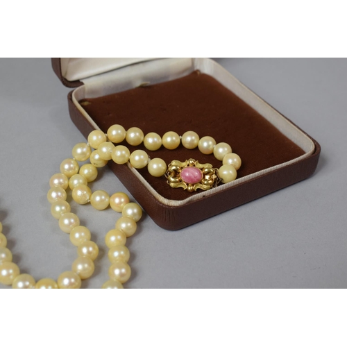 101 - A String of Cultured Pearls with an 18ct Gold Clasp Decorated with Pink Agate Stone, 32 Inches Long