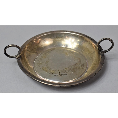 385 - A Circular Silver Wine Taster or Coaster with Two Raised Handles, 9.5cm Diameter, Sheffield 1905