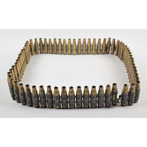 64 - A String of Spent Brass Machine Gun Bullets