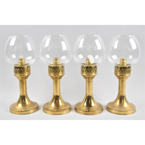 65 - A Set of Four Brass Candlesticks with Pierced Collars and Glass Shades, Each 27cm high Overall