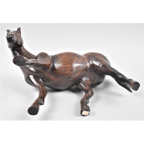 139 - A Carved Rosewood Study of a Mare, 28cm Long