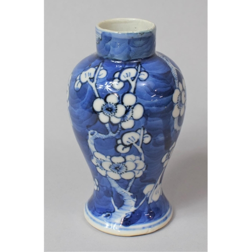 241 - A 19th Century Blue and White Prunus Pattern Vase, Four Character Mark to Base for Kangxi, 13cm high