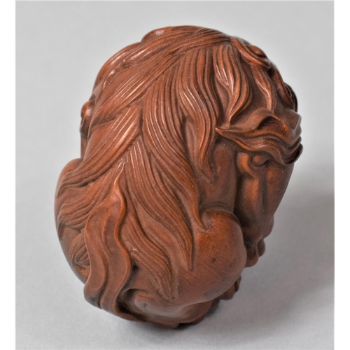 266 - A Nicely Carved Hardwood Temple Lion Ball, 6cm High