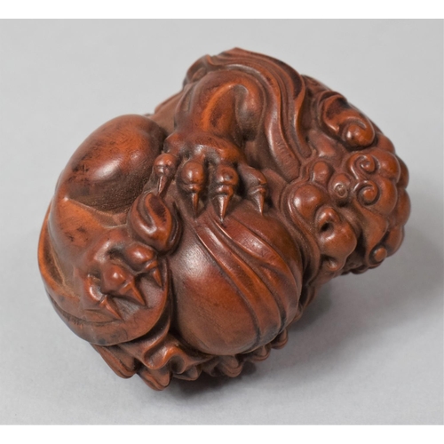 266 - A Nicely Carved Hardwood Temple Lion Ball, 6cm High