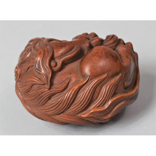 266 - A Nicely Carved Hardwood Temple Lion Ball, 6cm High