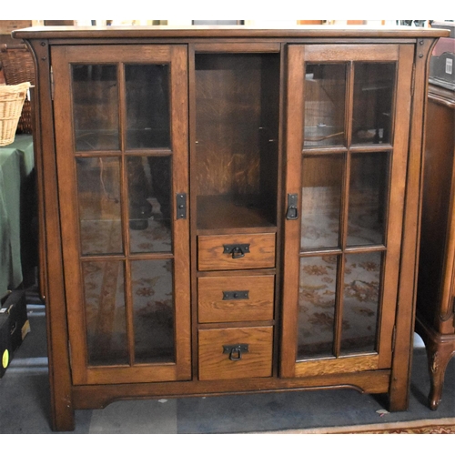 522 - A Mid 20th Century Side by Side Glazed Bookcase with Three Centre Drawers, 130cm wide