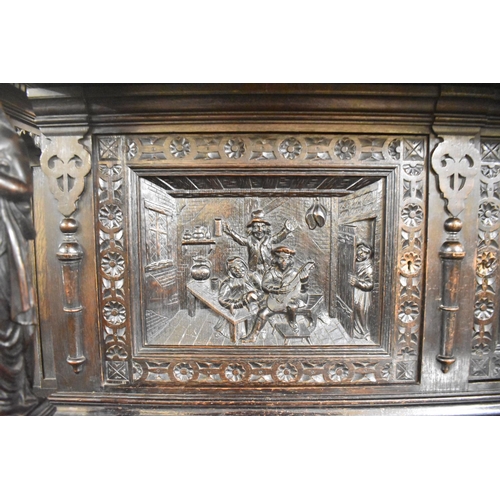 531 - A Late 19th Century Heavily Carved Oak Side Cabinet, Having Two Centre Drawers and Carved Panel Door... 