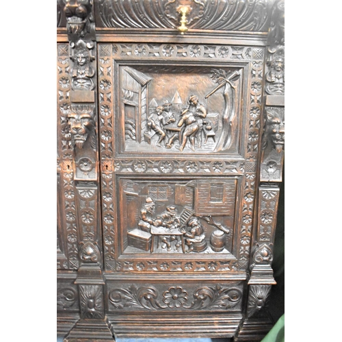 531 - A Late 19th Century Heavily Carved Oak Side Cabinet, Having Two Centre Drawers and Carved Panel Door... 