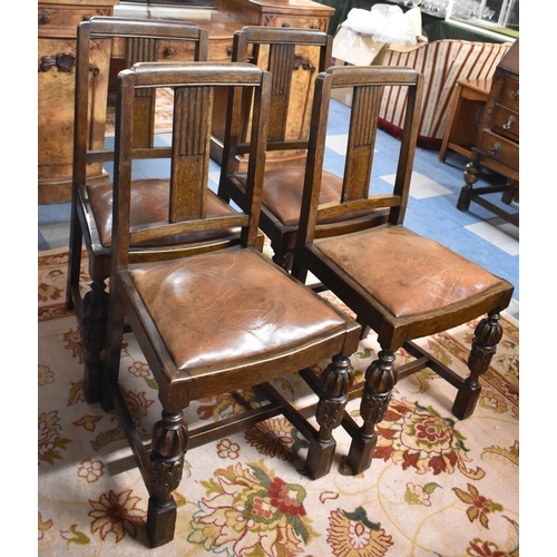 541 - A Set of Four Edwardian Oak Dining Chairs with Carved Bulbous Front Supports