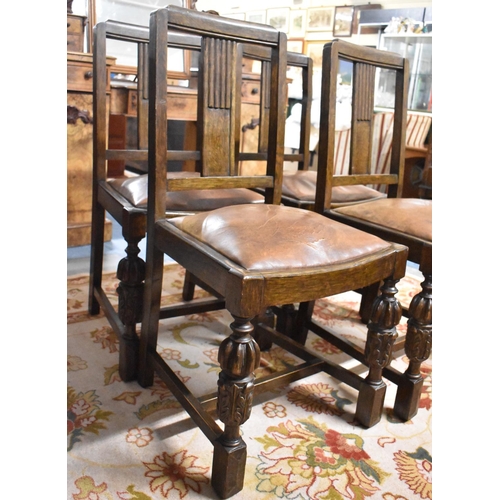 541 - A Set of Four Edwardian Oak Dining Chairs with Carved Bulbous Front Supports