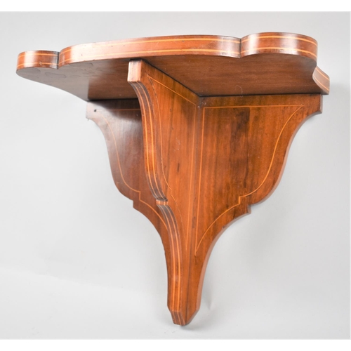 79 - An Edwardian String Inlaid Mahogany Wall Hanging Shelf Sconce, 31cm wide