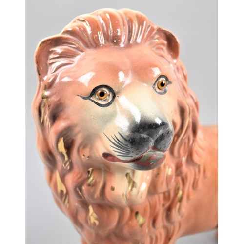 88 - A Late 19th/Early 20th Century Ceramic Study of a Standing Lion, with Glass Eyes, 31cm Wide