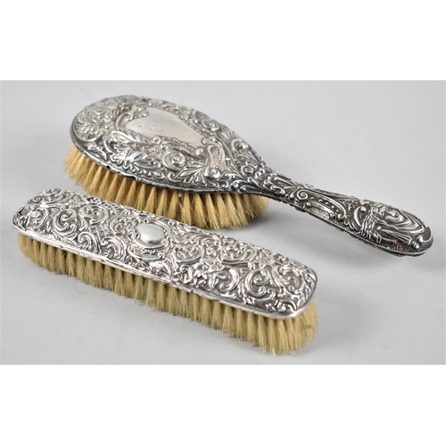 414 - Two Late 19th/Early 20th Century Embossed Silver Mounted Derssing Table Brushes