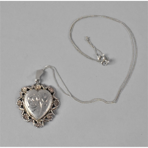 421 - A Silver Heart Shaped Locket Set in Pierced Floral Border, B'ham 1976, with Fine Silver Chain, 48cm ... 