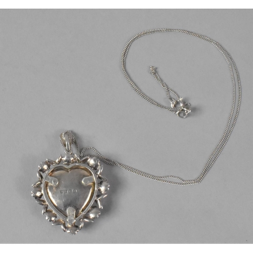 421 - A Silver Heart Shaped Locket Set in Pierced Floral Border, B'ham 1976, with Fine Silver Chain, 48cm ... 