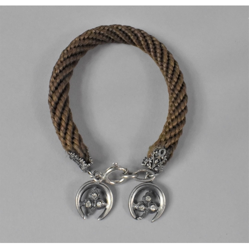 424 - A Victorian Braided Hair Bracelet with Silver Horseshoe Mount