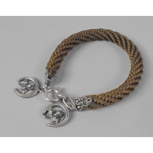 424 - A Victorian Braided Hair Bracelet with Silver Horseshoe Mount