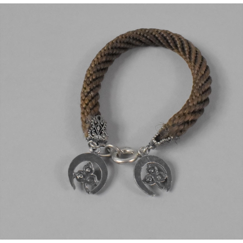 424 - A Victorian Braided Hair Bracelet with Silver Horseshoe Mount