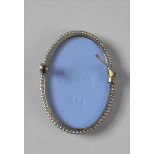 435 - A Blue and White Wedgwood Jasperware Oval Brooch, White Metal Ring, Stamped 14, and a Floral Brooch