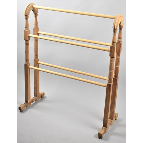 513 - A Reproduction Stripped Pine Victorian Style Towel Rail, 67cms Wide