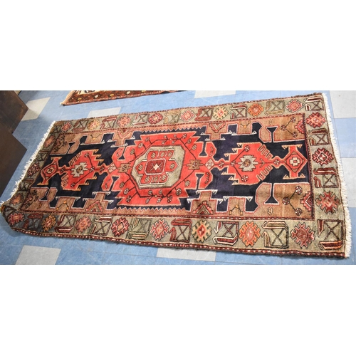 532 - An antique Persian Hand Made Kurdish Rug, 210x104cms