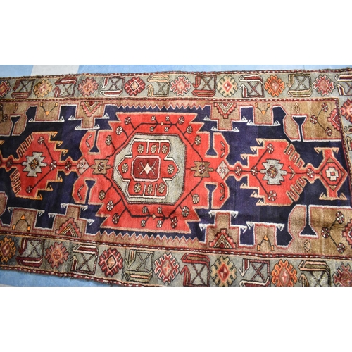 532 - An antique Persian Hand Made Kurdish Rug, 210x104cms