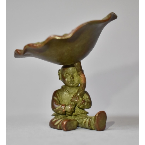 314 - A Bronze Study of Seated Boy Holding Lilly Pad, 6cm high