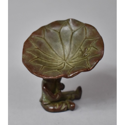 314 - A Bronze Study of Seated Boy Holding Lilly Pad, 6cm high