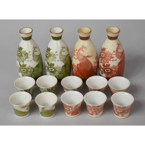 350 - Two Oriental Porcelain Decanter and Tot Sets, Two Colour Ways, Both Sets with Bird Decoration in Ora... 