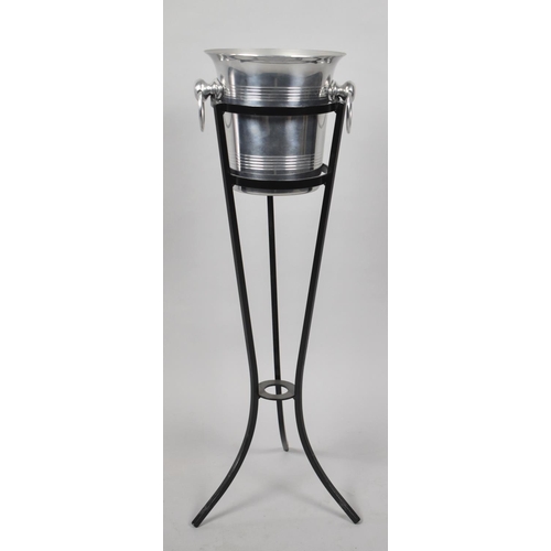 230 - A Polished Aluminium Two Handled Wine Cooler in Wrought Iron Tripod Stand, 76cm high Overall