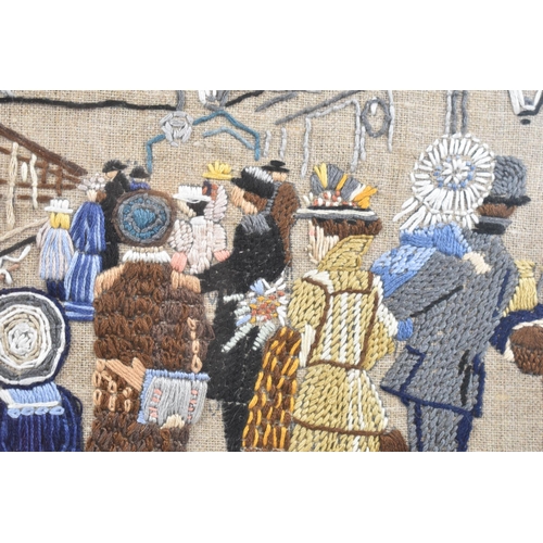 345 - A Framed Embroidery Depicting Railway Station Scene, Welcome Home, With Love Hazel