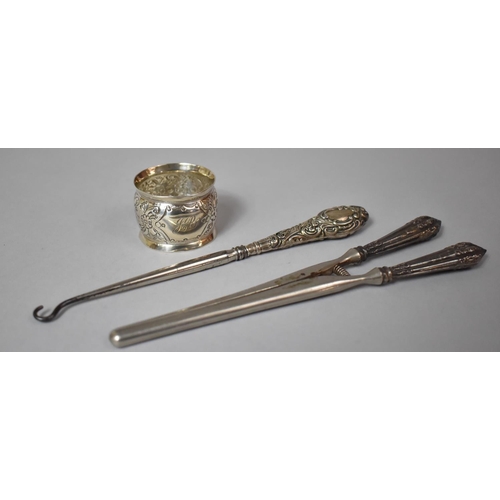 412 - A Silver Napkin Ring, Silver Handled Glove Stretcher and Silver Handled Button Hook