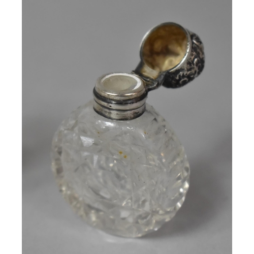 425 - A Collection of Three Silver Topped Glass Scent Bottles, One with Enamelled Top